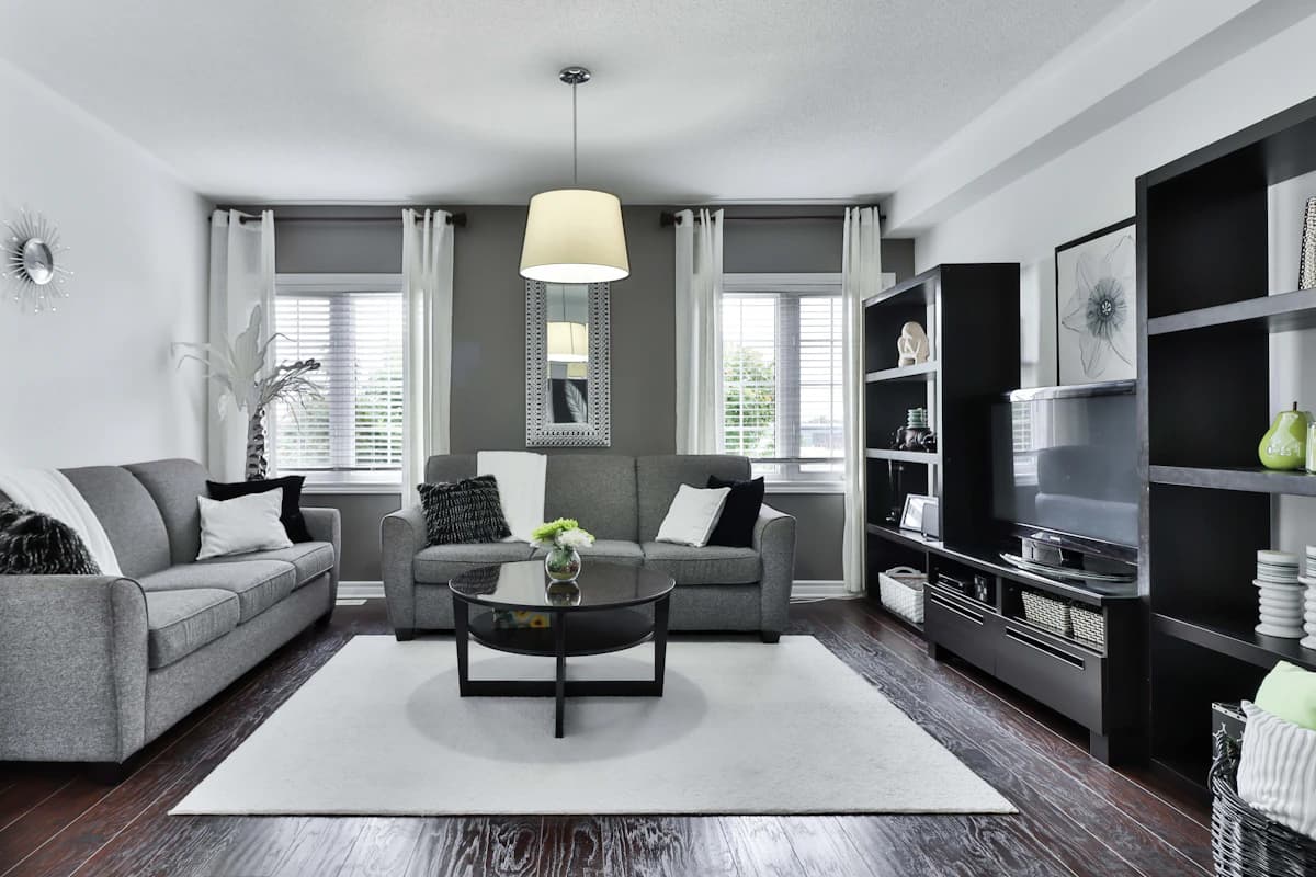 Premium modern Delhi living room interior with bookshelf and statement lighting